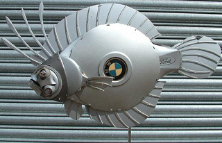 Illustration for article titled Hubcap Sculptures Make Robot Pets